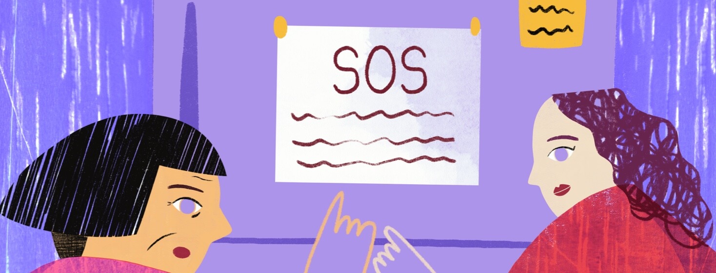 two women point to an SOS plan taped to a fridge