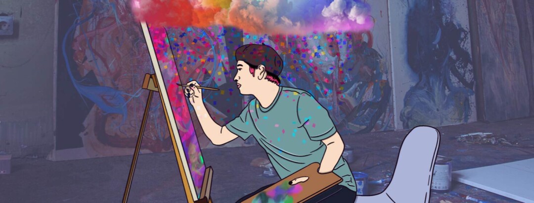 Adult Male sits painting on an easel while a colorful cloud of creativity sprinkles confetti above them