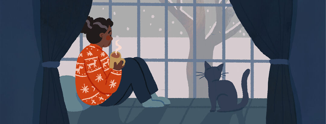 An older black woman sits at a snowy window wearing a bright red christmas sweater